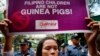 A woman displays a placard during a rally outside the Department of Health to protest the administration of the anti-Dengue vaccine Dengvaxia which was developed by Sanofi Pasteur, Feb. 7, 2018, in Manila, Philippines.