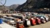 FILE - Trucks are parked at Pakistan-Afghanistan border Torkham, Oct. 19, 2018. 