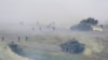 FILE - Soldiers participate in the annual Han Kuang military exercises that simulate an anti-landing operations near the coast in New Taipei City, northern Taiwan, July 27, 2023. 