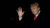 U.S. President Donald Trump waves as he walks on South Lawn of the White House upon his return to Washington, from France, Nov. 11, 2018. 