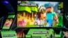 FILE - Lydia Winters shows off Microsoft's Minecraft built specifically for HoloLens at the Xbox E3 2015 briefing before Electronic Entertainment Expo, June 15, 2015, in Los Angeles.