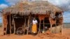 FILE - Salama Masha, a former follower of extremist evangelical leader Paul Mackenzie, stands outside a makeshift house near the scene where dozens of bodies were found in shallow graves in the village of Shakahola in southern Kenya, on Sept. 5, 2024.