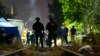 Las autoridades chilenas acordonan la zona donde fue hallada el cuerpo del exmilitar venezolano Ronland Ojeda, en Santiago de Chile, el 1 de marzo de 2024.