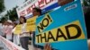 South Korean protesters hold signs during a rally to denounce deploying the Terminal High-Altitude Area Defense, or THAAD, in front of Defense Ministry in Seoul, South Korea, July 8, 2016.