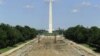 Tourists walk past work underway to reconstruct the Lincoln Memorial Reflecting Pool on the National Mall in Washington, May 11, 2011.