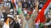 Supporters of Indian anti corruption activist Arvind Kejriwal, unseen, cheer at the formal launch of his political party 'Aam Aadmi Party (AAP)' in New Delhi, November 26, 2012.