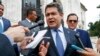 El entonces presidente e Honduras, Juan Orlando Hernández, responde a preguntas de la prensa durante una visita a Washington el 13 de agosto de 2019.