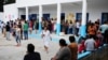 Voters queue outside a polling station during the first round of the presidential election, in La Marsa, outside Tunis, Tunisia, Sept. 15, 2019. 