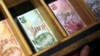 Turkish lira banknotes are pictured at a currency exchange office in Istanbul, Turkey, Aug. 13, 2018. 