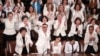 FILE - Democratic female members of Congress cheer after President Donald Trump said there are more women in Congress than ever before, during his second State of the Union address to a joint session of Congress at the U.S. Capitol in Washington, Feb. 5, 2019.