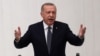 Turkish President Recep Tayyip Erdogan gestures as he delivers a speech during the opening of the third legislative session of the Turkish parliament’s 27th term, at the Grand National Assembly of Turkey in Ankara, Oct. 1, 2019. Turkish President Recep T