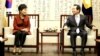 South Korean President Park Geun-hye talks with parliament speaker Chung Sye-kyun during their meeting at the National Assembly in Seoul, South Korea, Nov. 8, 2016.