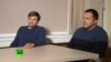 A still image taken from video footage and released by Russia's RT international news channel Sept. 13, 2018, shows two Russian men identified as Alexander Petrov and Ruslan Boshirov during an interview at an unnamed location. 