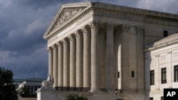 In this June 8, 2021 photo, the Supreme Court is seen in Washington. (AP Photo/J. Scott Applewhite)