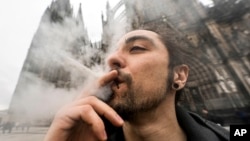 A man smokes cannabis in Cologne, Germany, on April 1, 2024. European police on April 11 arrested members of a gang they say defrauded victims in 35 countries in a medical cannabis Ponzi scheme.