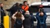 Suspect Luigi Mangione is taken into the Blair County Courthouse on Dec. 10, 2024, in Hollidaysburg, Pennsylvania.