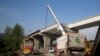 FILE - Work is pictured at an international trade route near Havalian in Pakistan, May 11, 2017, as part of China's Belt and Road Initiative.
