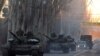 Ukraine - Pro-Russian separatists patrol a street in the eastern Ukrainian city of Makeyevka on February 18, 2015.