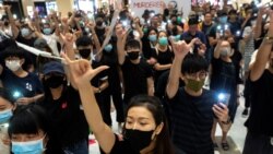 VOA Asia - Hong Kong changes tactics