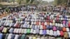 Muslims pray while Christians form a protective human chain around them during a protest on common problems faced in Nigeria, January 1, 2012.
