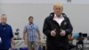 FILE - President Donald Trump gives a thumbs up after meeting people impacted by Hurricane Harvey during a visit to Houston, Texas, Sept. 2, 2017.