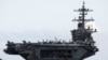 FILE - The USS Theodore Roosevelt is seen entering into the port in Da Nang, Vietnam, March 5, 2020.