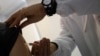 FILE - Doctor Roberto Ieraci vaccinates a woman in Rome as Italy battles one of its worst epidemics of measles in recent years, Feb. 23, 2018. 