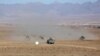 FILE - Afghan police special forces demonstrate their skills during an exercise in the Mohammad Agha district of Logar province, eastern of Kabul, Afghanistan, Nov. 30, 2017.