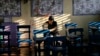 A Filipino woman votes during the country's midterm elections inside a polling center at a school in Manila, Philippines on Monday, May 13, 2019. 