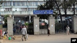 FILE - People walk past the Federal High Court building in Addis Ababa, Ethiopia, Nov. 1, 2011. Observers say Ethiopian courts frequently use the country's anti-terrorism laws to restrict activities of government critics.