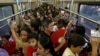 FILE - Commuters ride a train during rush hour on Southeast Asia's first light rail transit network, which is 29-years-old, in Manila, Oct. 10, 2013. The Philippines is about to spend $169 billion on infrastructure, including railways and an airport terminal.