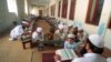 An undated photo of Pakistani children studying the Quran at a religious school in Lahore, Pakistan. Pakistan's religious schools, or madrassas, face renewed scrutiny with many alleging that the schools serve as breeding grounds for violent extremists.