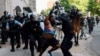 FILE - Police clear protesters from Lafayette Park and the area around it across from the White House for President Donald Trump to be able to walk to St. John's Church on June 1, 2020.