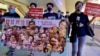 香港社民连主席陈宝莹(右起)与外务副主席周嘉发、成员余炜彬及前东区区议员曾健成，在十一中国国庆日游行，要求全中国实行普选、释放所有政治犯 (美国之音/汤惠芸)
