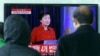 FILE - People watch a live broadcast of South Korean President Park Geun-hye's press conference, at the Seoul Railway Station in Seoul, South Korea, Jan. 13, 2016. Park called for resumption of nuclear talks, even if Pyongyang does not participate. 