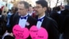 John Lewis and Stuart Gaffney, partners of 25 years, outside of the Supreme Court in Washington, March 26, 2013. (M. Bowman/VOA)