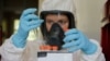 A scientist works inside a laboratory of the Gamaleya Research Institute of Epidemiology and Microbiology during the testing of a coronavirus vaccine, in Moscow, Russia, Aug. 6, 2020. (Russian Direct Investment Fund / Handout via Reuters) 