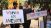Participants prepare to march in Nairobi's Karura forest during the Women's March, Kenya. January 21, 2017. (J.Craig/VOA)
