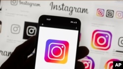FILE - The Instagram logo is seen on a cell phone on Oct. 14, 2022. Thousands of users of Meta's Facebook, Instagram and Threads platforms experienced login issues on March 5, 2024, in what appeared to be a widespread outage.