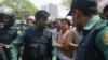 An opposition BNP activist is being arrested by policemen in Dhaka. In 2018, thousands of opposition leaders and activists were arrested in Bangladesh on allegedly trumped up cases of political violence.