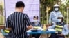 សកម្មភាព​ផាក​ពិន័យ​បទ​ល្មើស​ចរាចរ​របស់​ប៉ូលិស​នៅ​ព្រឹក​ថ្ងៃទី​០១ ឧសភា ឆ្នាំ២០២០​នេះ​បន្ទាប់ពី​មាន​ការរឹតបន្តឹង​និង​តម្លៃ​ផាកពិន័យ​បាន​កើនឡើង​ តាម​ផ្លូវក្នុង​រាជធានី​ភ្នំពេញ​ប្រទេស​កម្ពុជា។ (ទុំ ម្លិះ/VOA)