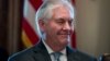 Secretary of State Rex Tillerson smiles as President Donald Trump speaks during a Cabinet meeting in the Cabinet Room of the White House in Washington, March 13, 2017.