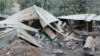 Rumah-rumah yang rusak akibat letusan Gunung Lewotobi Laki-laki di Flores Timur, Senin, 4 November 2024. (Foto: AP Photo)