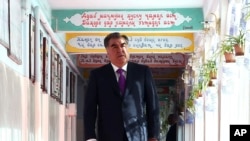 Tajik President Emomali Rakhmon arrives at a polling station in Dushanbe, Tajikistan, Sunday, May 22, 2016. 