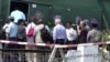 FILE - In this image made from video, U.N. Security Council ambassadors board a helicopter to fly to Maungdaw district of Rakhine State, in Sittwe, Myanmar, Tuesday, May 1, 2018. 