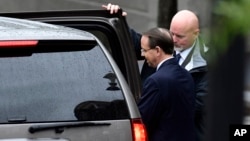 FILE - Deputy Attorney General Rod Rosenstein leaves the White House in Washington, Sept. 24, 2018. 