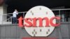 FILE - A person walks into the Taiwan Semiconductor Manufacturing Co., headquarters in Hsinchu, Taiwan on Oct. 20, 2021. The company said on May 16, 2024, there was no damage to facilities after an explosion at an Arizona factory construction site.