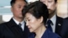 Ousted South Korean President Park Geun-hye arrives at the Seoul Central District Court for a hearing on a prosecutors' request for her arrest for corruption, in Seoul, South Korea, March 30, 2017. The arrest of South Korea's first female president marks a stunning fall for the scion of a powerful general who himself ruled the country during her teenage years and into her 20s. Park was jailed March 31, 2017, three weeks after the Constitutional Court stripped her of office over a corruption scandal. 