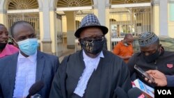 Veteran lawyer Tendai Biti, who represented Musa Kika, is seen speaking to journalists outside Zimbabwe's High Court in Harare, May 15, 2021. (Columbus Mavhunga/VOA)