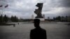 FILE - A soldier stands guard at the doors of the War Museum visited by foreign reporters during a government-organized tour in Pyongyang, North Korea, Oct. 9, 2015.